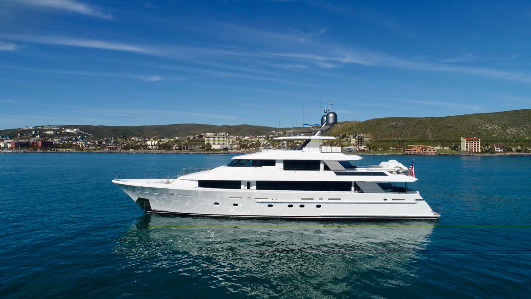 A motor yacht photographed in profile for a listing