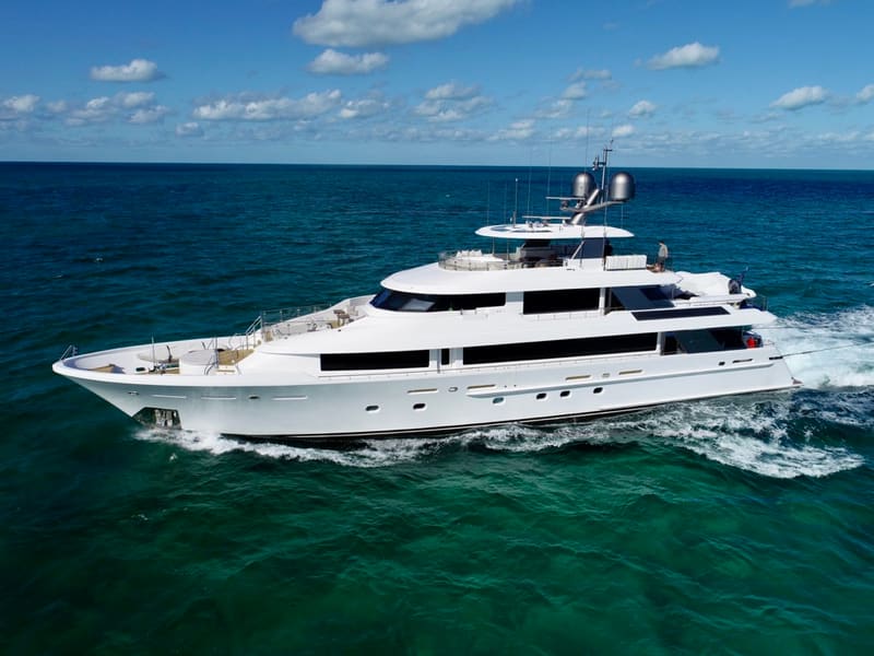 A tri-deck motor yacht underway