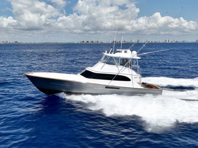 A sportfish convertible running with towers up