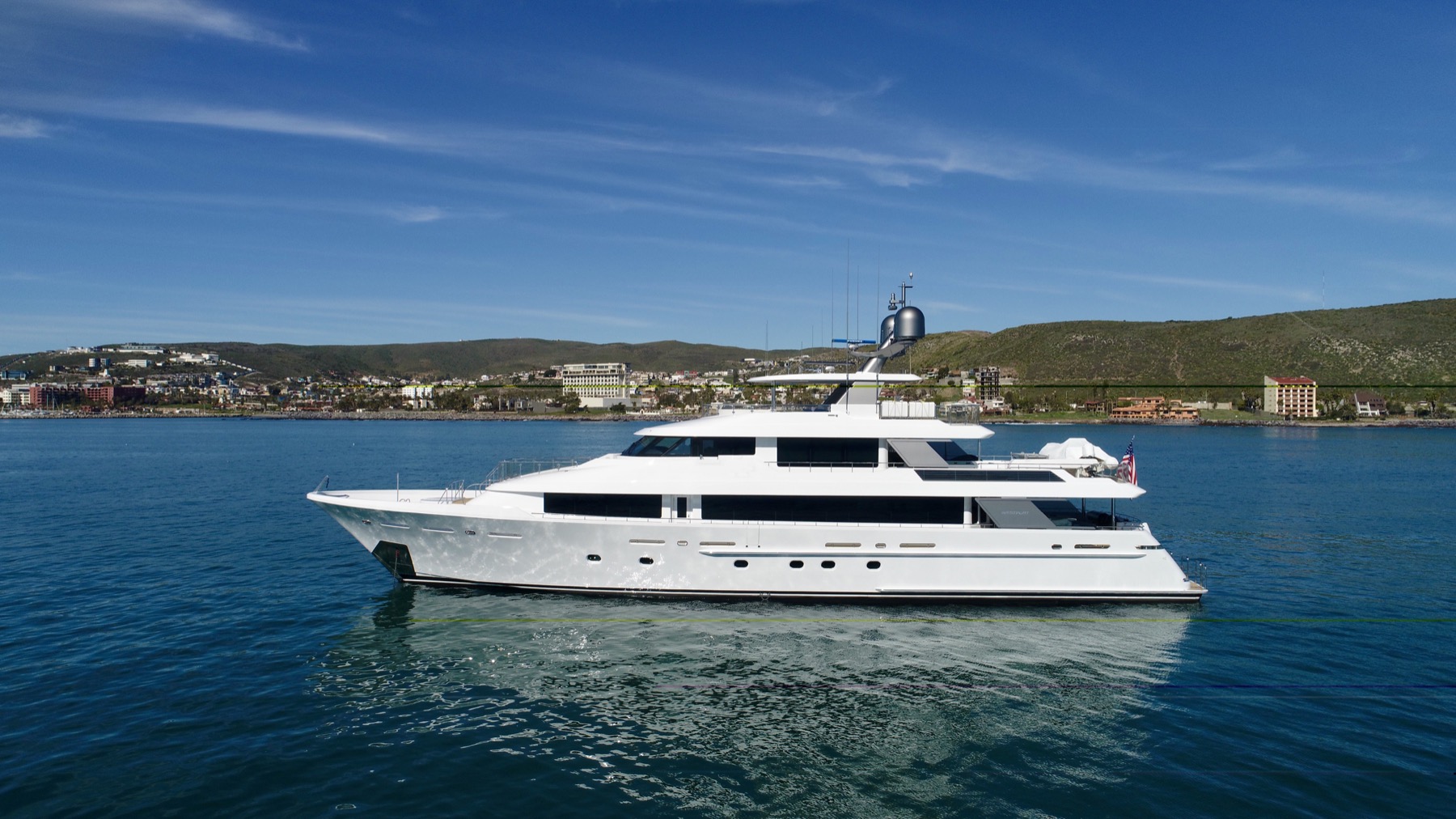 A motor yacht photographed in profile for a listing