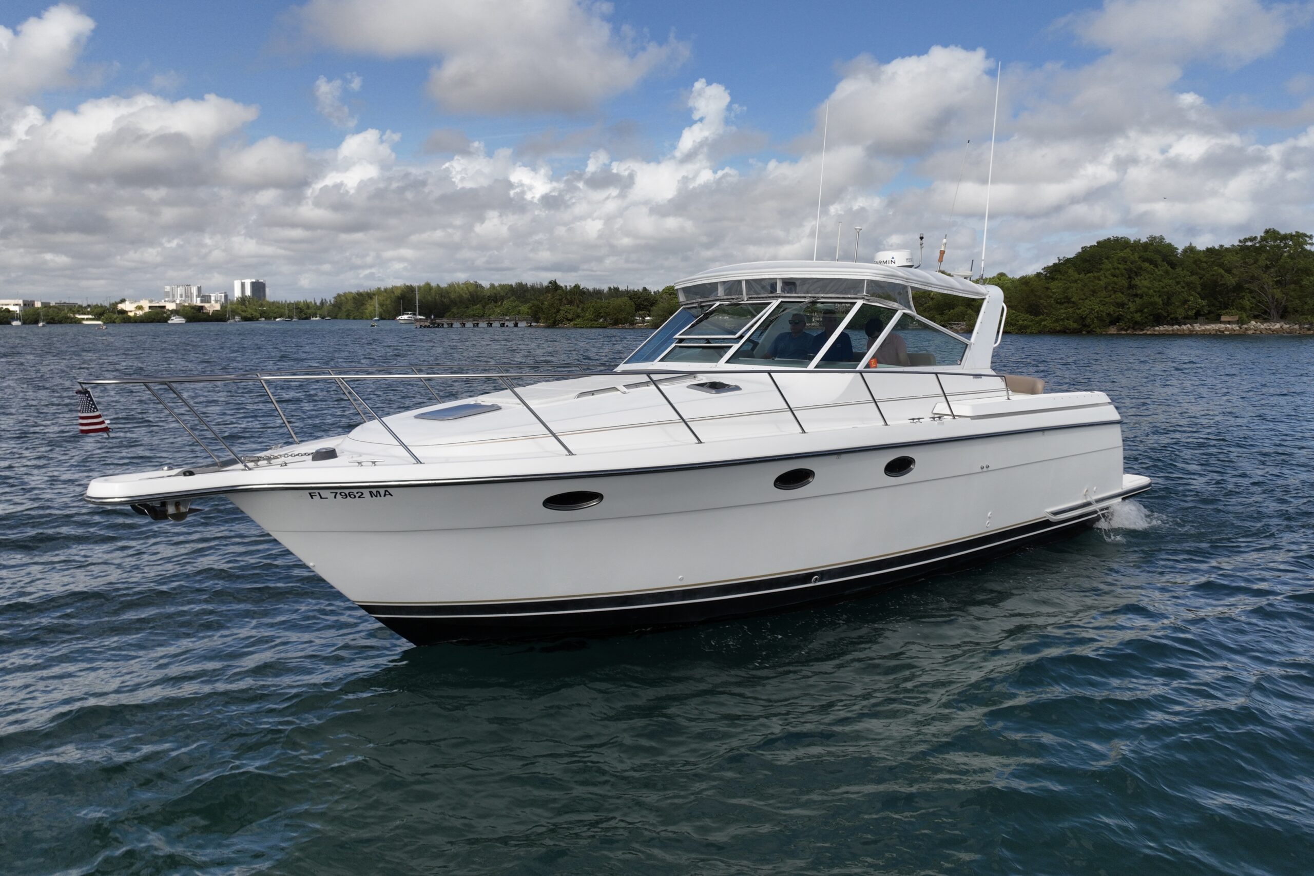 White boat cruising on water